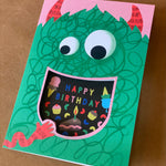 monster Eating Cake Birthday Card with cut-out mouth